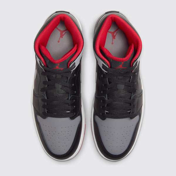 Air Jordan 1 Mid Black Cement sneaker – top view of the pair