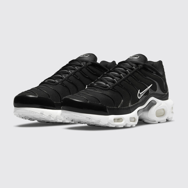 Women's Nike Air Max Plus Black White sneaker – three-quarter view of the pair