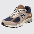 New Balance 2002R Beige Navy sneaker – front three-quarter view