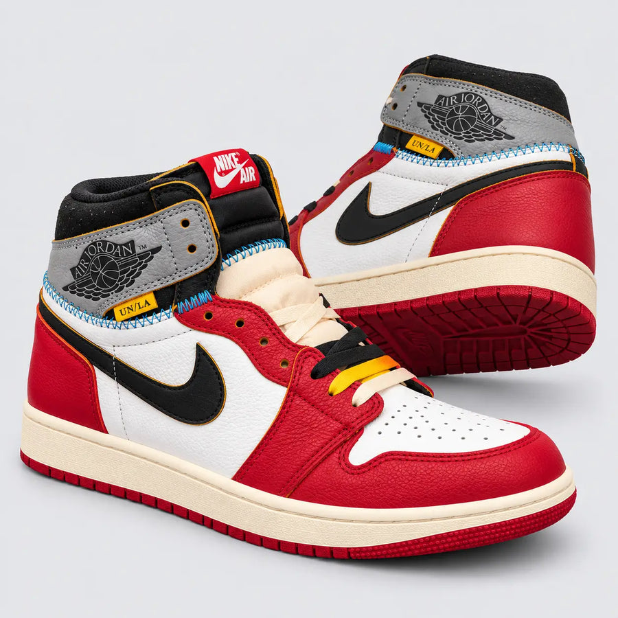 Angled view of Union LA Air Jordan 1 high tops showing red overlays, cream midsoles and blue stitching