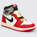 Front angle of red and white Air Jordan 1 High x Union LA showing multicolour laces and yellow UN/LA tab